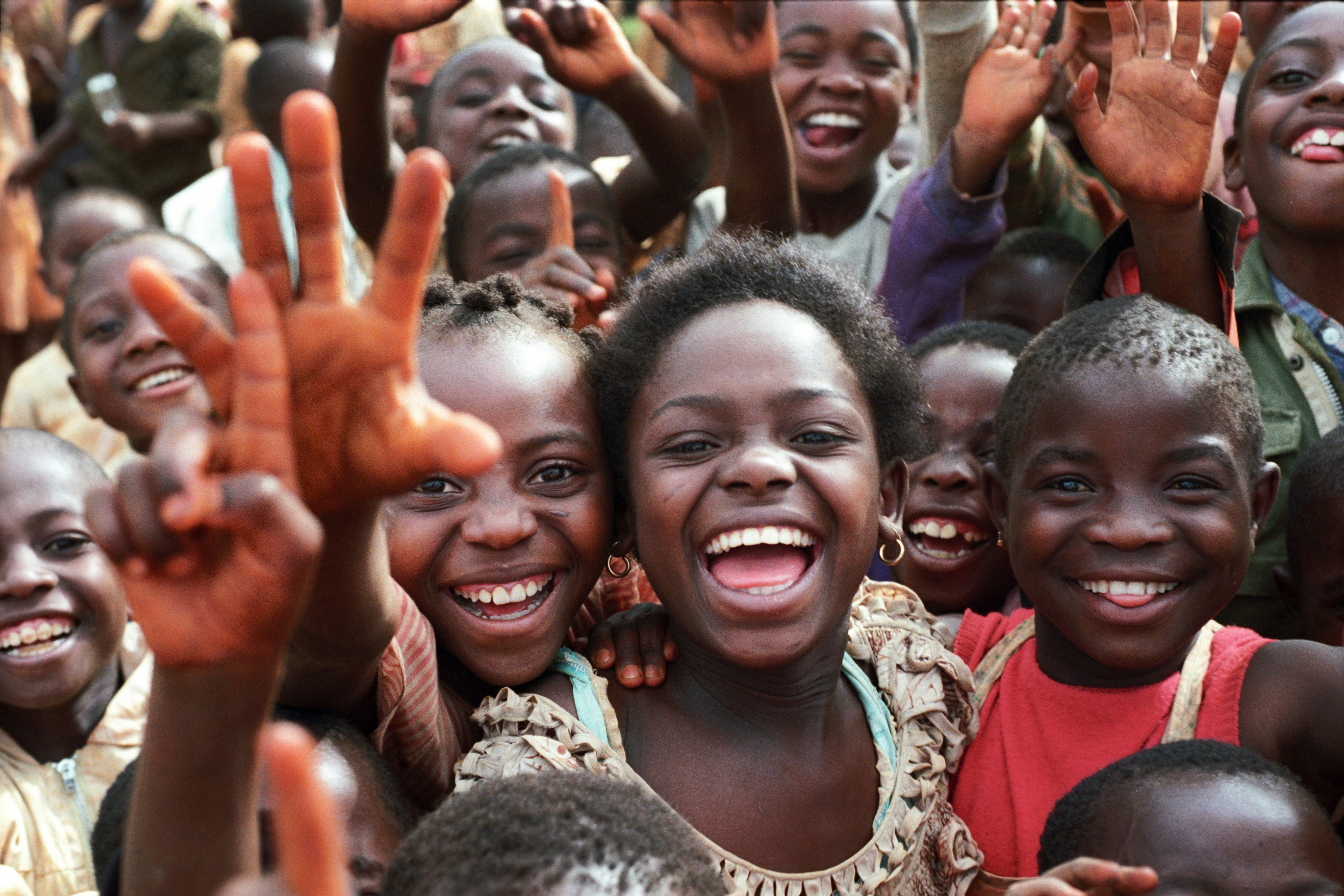 Happy children smiling and waving